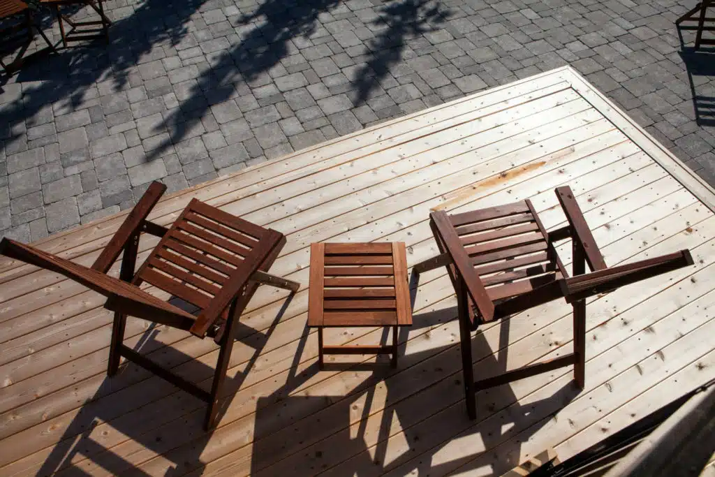Aerial view of wooden deck with two chairs and a table