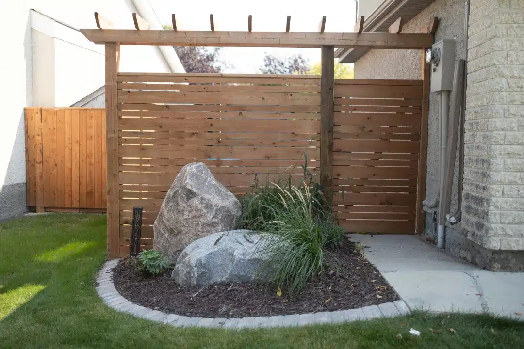 New fence with landscaping rocks