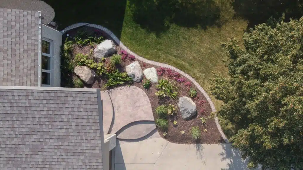 Aerial view of house with new landscaping