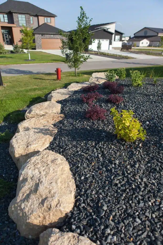 Landscaped front garden with boulders
