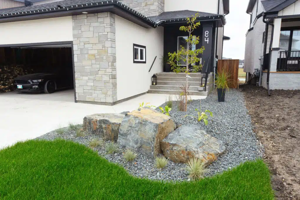 View of rock features in a front yard rock planting bed.