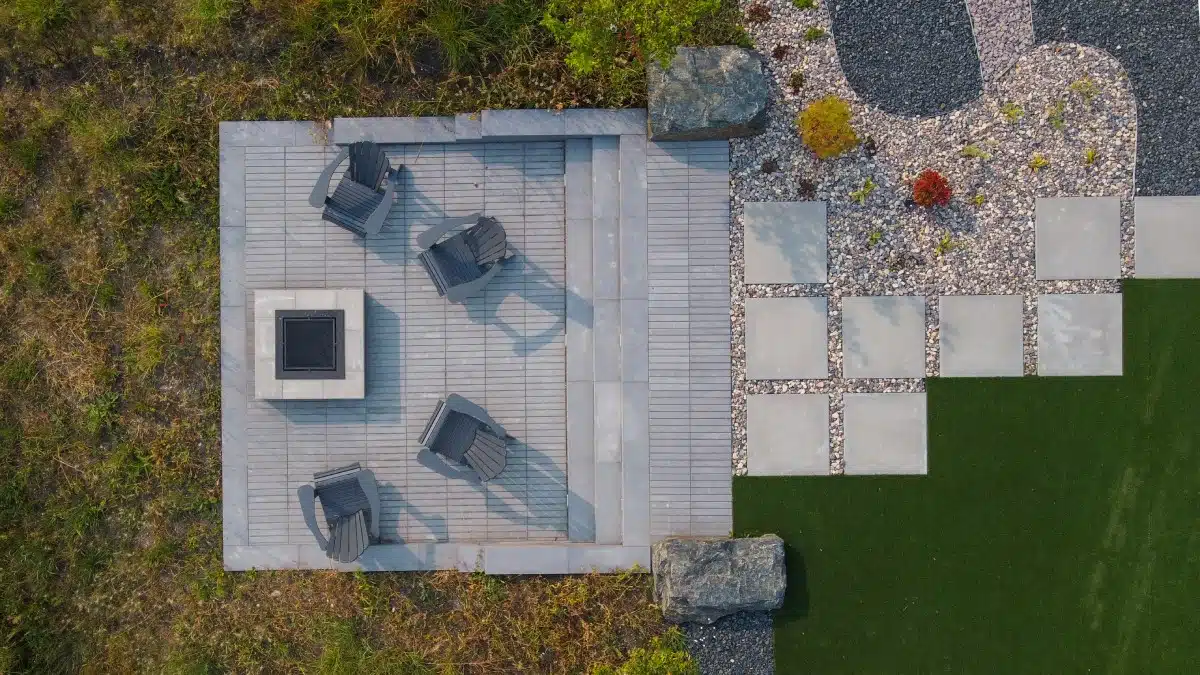 Aerial view of completed project; new patio, path, and fireplace.