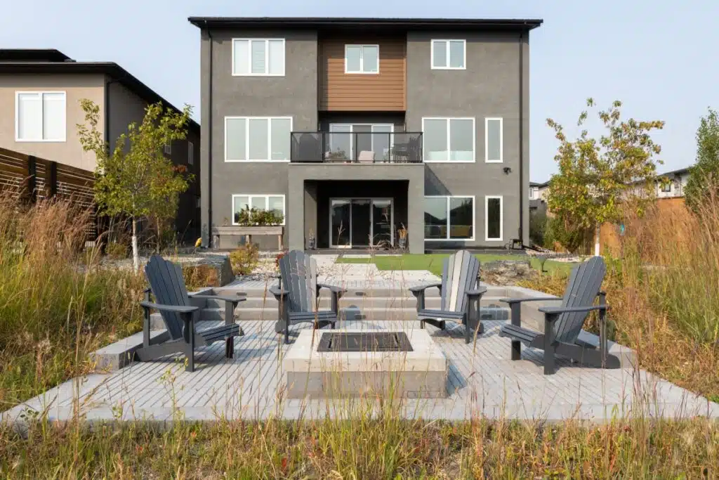 straight view of completed project; new patio, path, and fireplace.