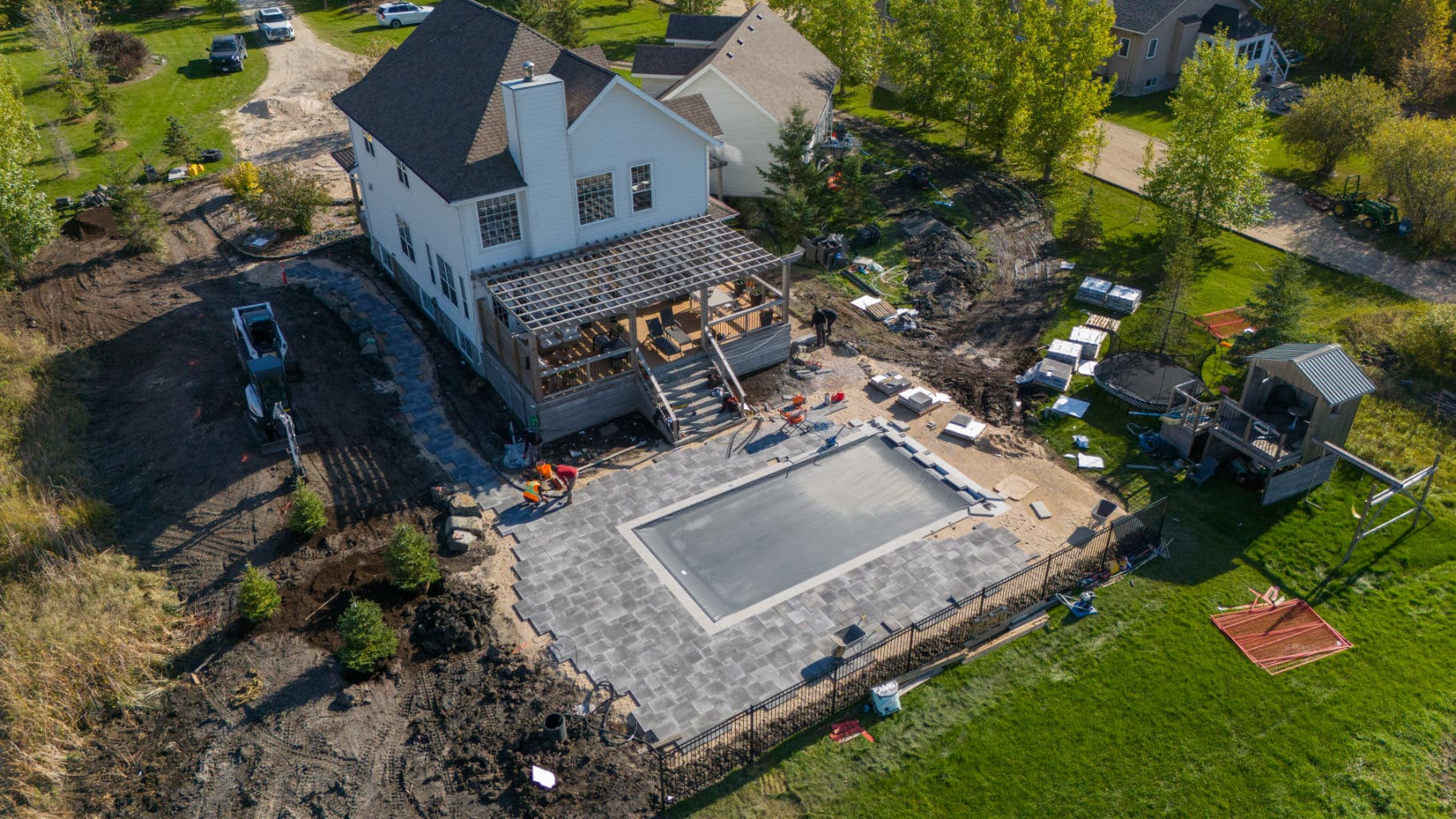 Backyard pool patio installation in progress